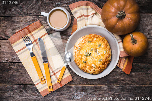 Image of Coffee with flatbread and pumpkins in rustic style