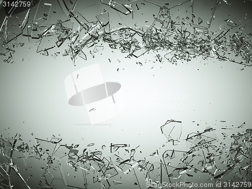 Image of Pieces of splitted or cracked glass on grey