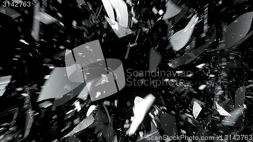 Image of Destructed glass on black with motion blur