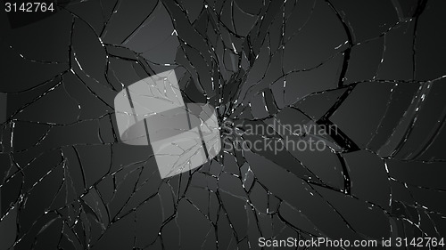 Image of Pieces of shattered or cracked glass on black