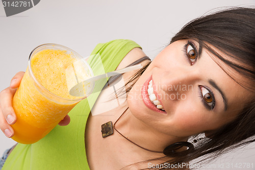 Image of Attractive Woman Intimate Portrait Drinking Orange Fruit Smoothi