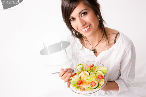 Image of Healthy Eating Woman Enjoys Raw Food Fresh Green Salad