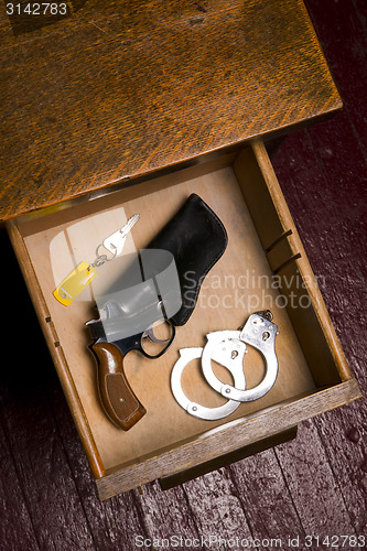 Image of 38 Revolver Gun Holster Desk Drawer Key Handcuffs Restraints