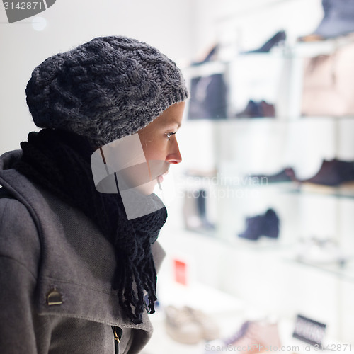 Image of Woman window shopping.