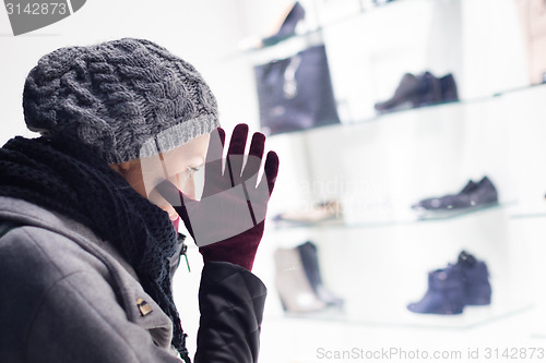 Image of Woman window shopping.