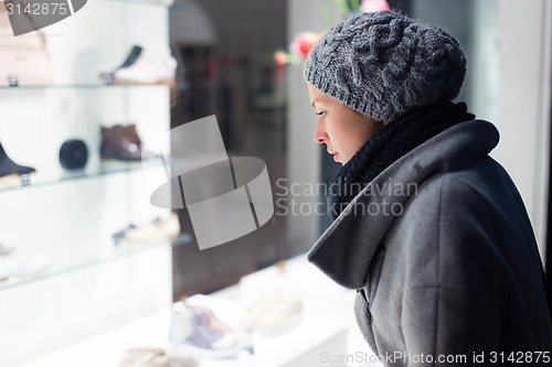 Image of Woman window shopping.