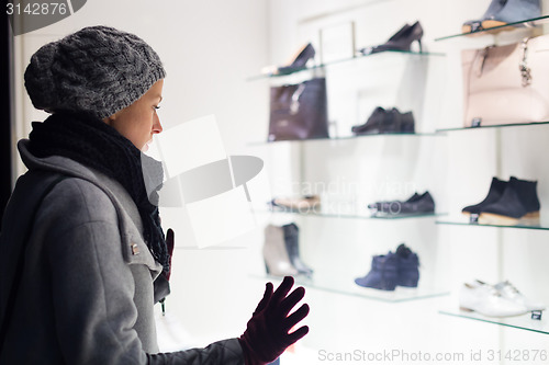 Image of Woman window shopping.