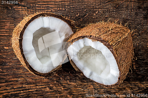 Image of coconut on old wooden table