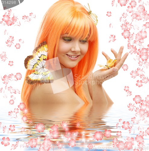 Image of butterfly girl with flowers in water