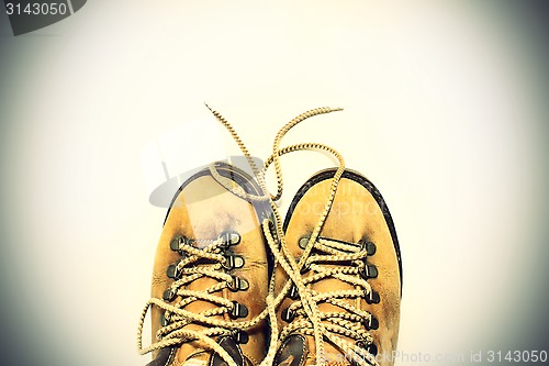 Image of White background with yellow shoes