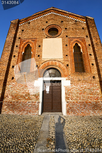 Image of  church  in  the parabiago  old   closed brick tower sidewalk  