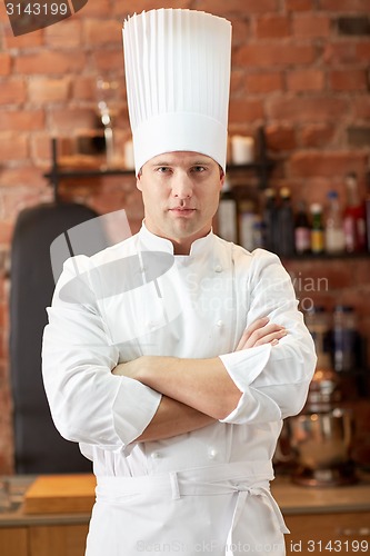 Image of happy male chef cook in restaurant kitchen