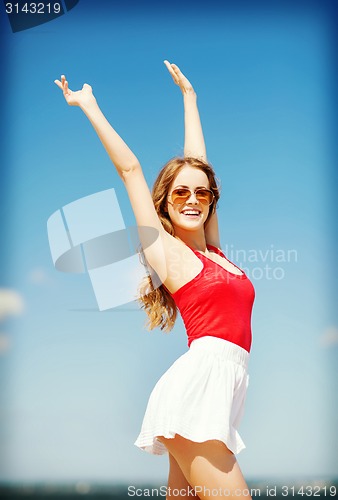 Image of girl standing on the beach