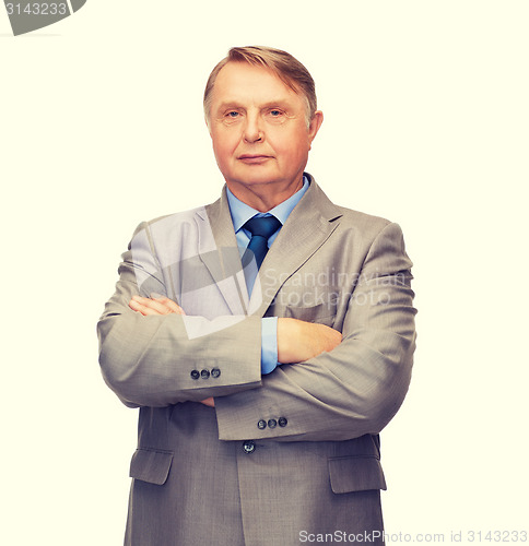 Image of serious businessman or teacher in suit