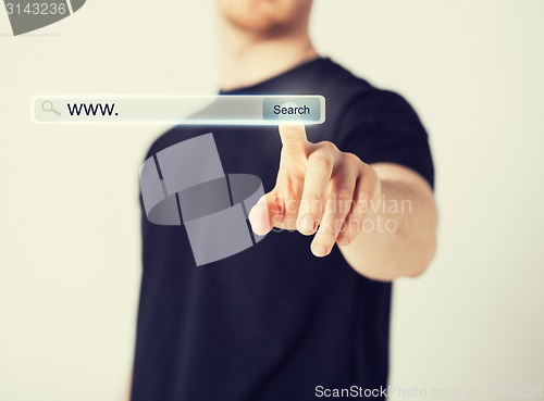 Image of male hand pressing Search button