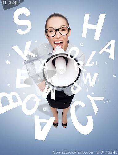 Image of screaming businesswoman with megaphone