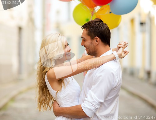 Image of couple with colorful balloons