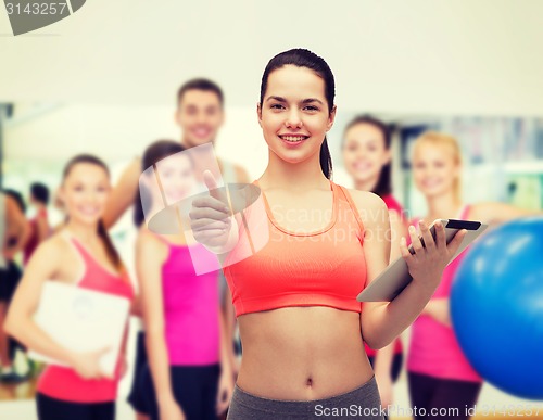 Image of sporty woman with tablet pc computer
