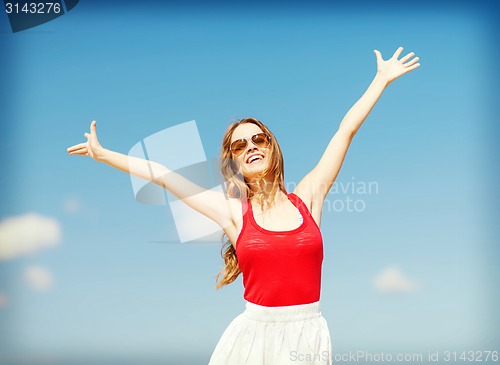 Image of girl standing on the beach