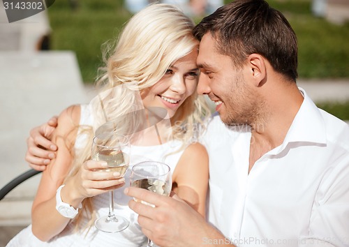 Image of couple drinking wine in cafe