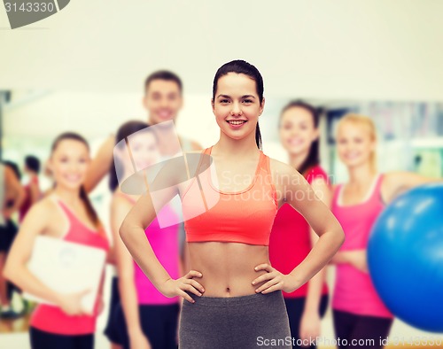 Image of smiling teenage girl in sportswear