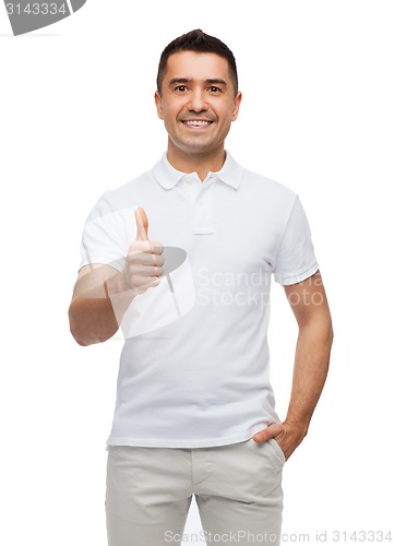 Image of smiling man showing thumbs up