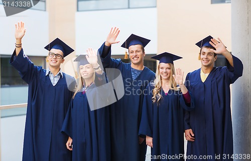 Image of group of smiling students in mortarboards