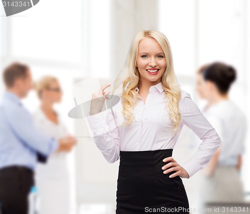 Image of smiling businesswoman or secretary in office