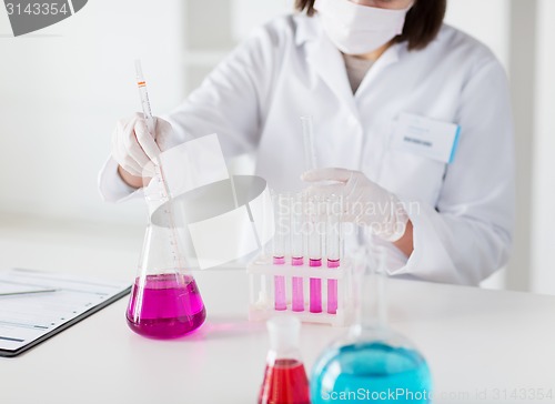 Image of close up of scientist making test in lab