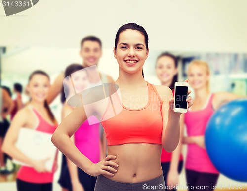 Image of sporty woman with smartphone