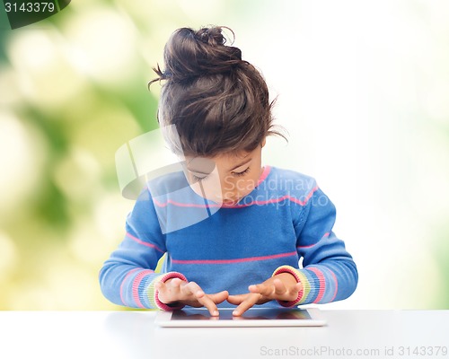 Image of little girl with tablet pc over green background