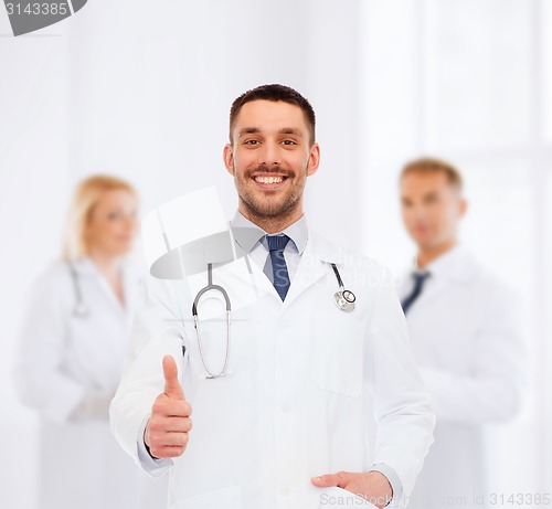 Image of smiling doctor with stethoscope showing thumbs up