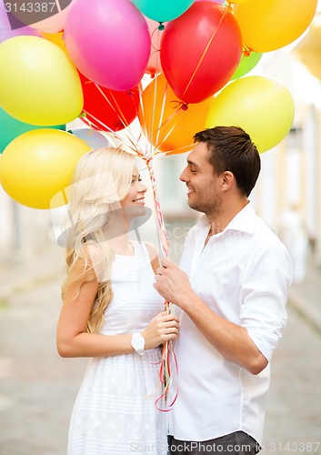 Image of couple with colorful balloons