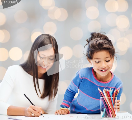 Image of mother and daughter drawing