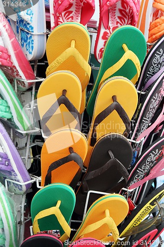 Image of Bright flip flops for summer.