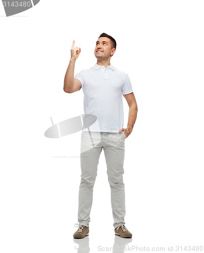 Image of smiling man pointing finger up