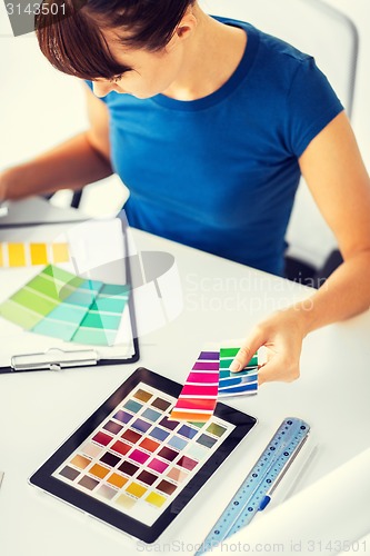 Image of woman working with color samples for selection