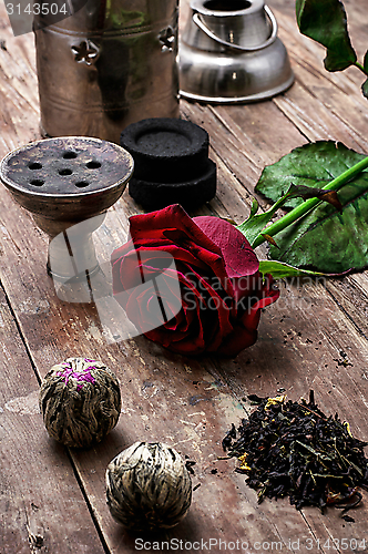 Image of hookah and dry elite tea leaves