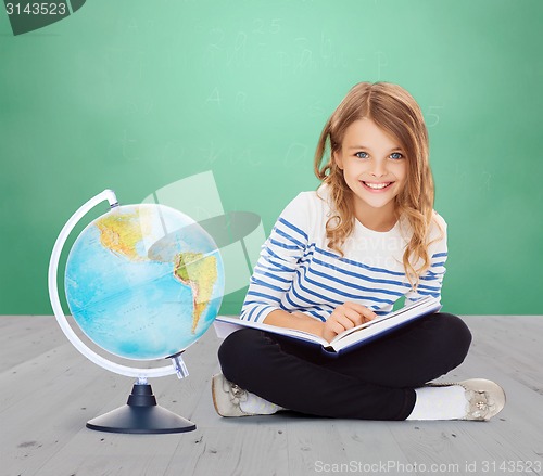 Image of girl with globe and book