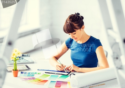 Image of woman working with color samples for selection