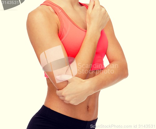 Image of sporty woman with pain in elbow