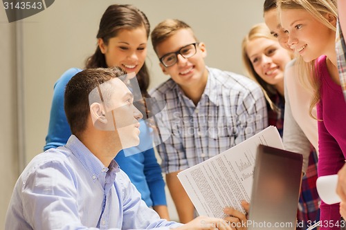 Image of group of students and teacher with laptop