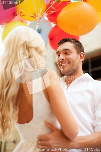 Image of couple with colorful balloons