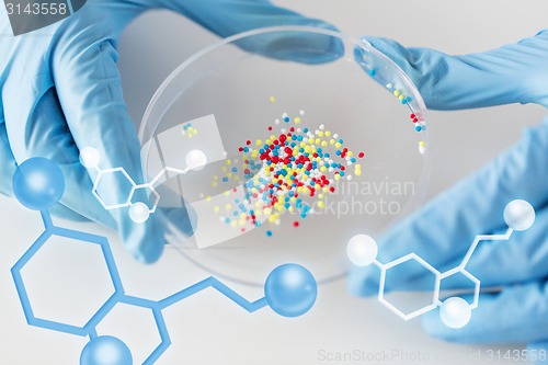 Image of close up of scientist hands holding chemical cure