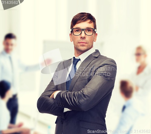 Image of attractive buisnessman or teacher in glasses