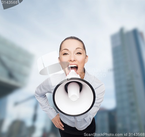 Image of screaming businesswoman with megaphone