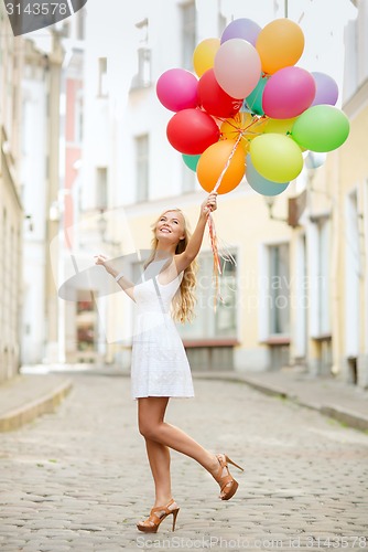 Image of woman with colorful balloons