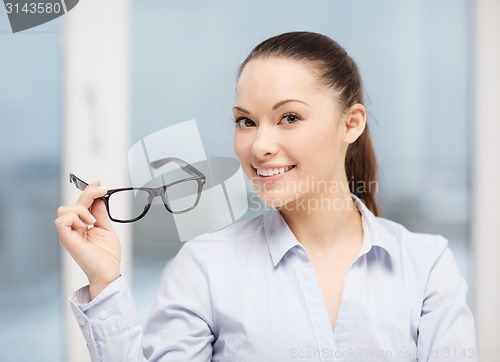 Image of laughing businesswoman with glasses