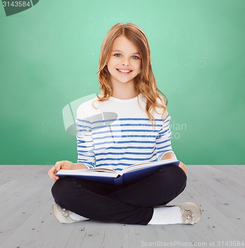 Image of student girl studying and reading book