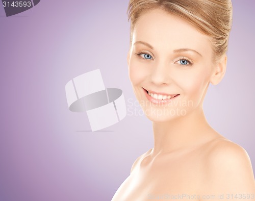 Image of beautiful young woman with bare shoulders